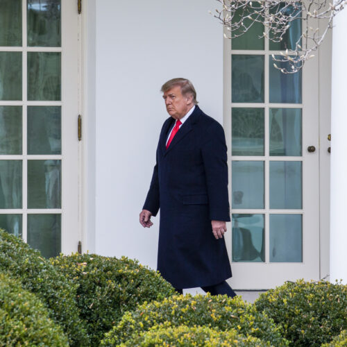 President Trump walks outside the White House