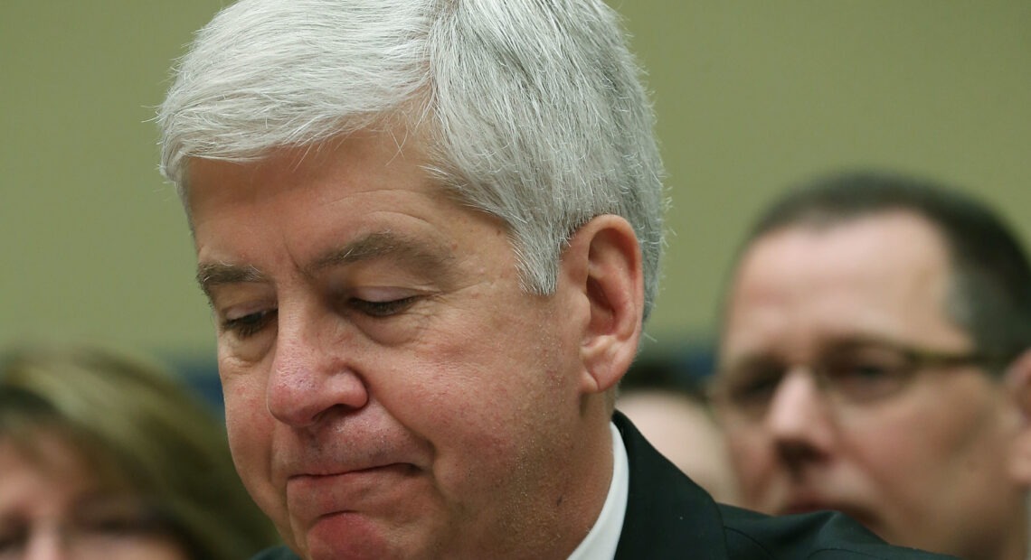 Now Former Michigan Gov. Rick Snyder, (R-MI), listens to Congressional members remarks during a House Oversight and Government Reform Committee hearing, about the Flint, Mich. water crisis in 2016. Mark Wilson/Getty Images