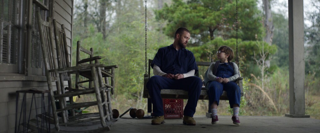 Justin Timberlake (left) and Ryder Allen star as Eddie and Sam in the new movie Palmer on Apple TV+. Apple TV+