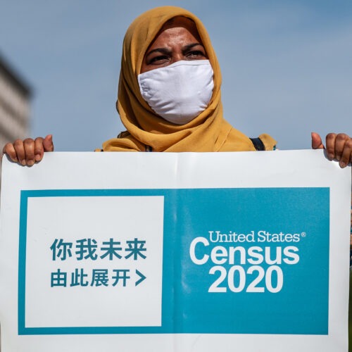 A census supporter holds up a sign during a 2020 rally in New York City. CREDIT: Gabriele Holtermann-Gorden/Sipa USA via Reuters