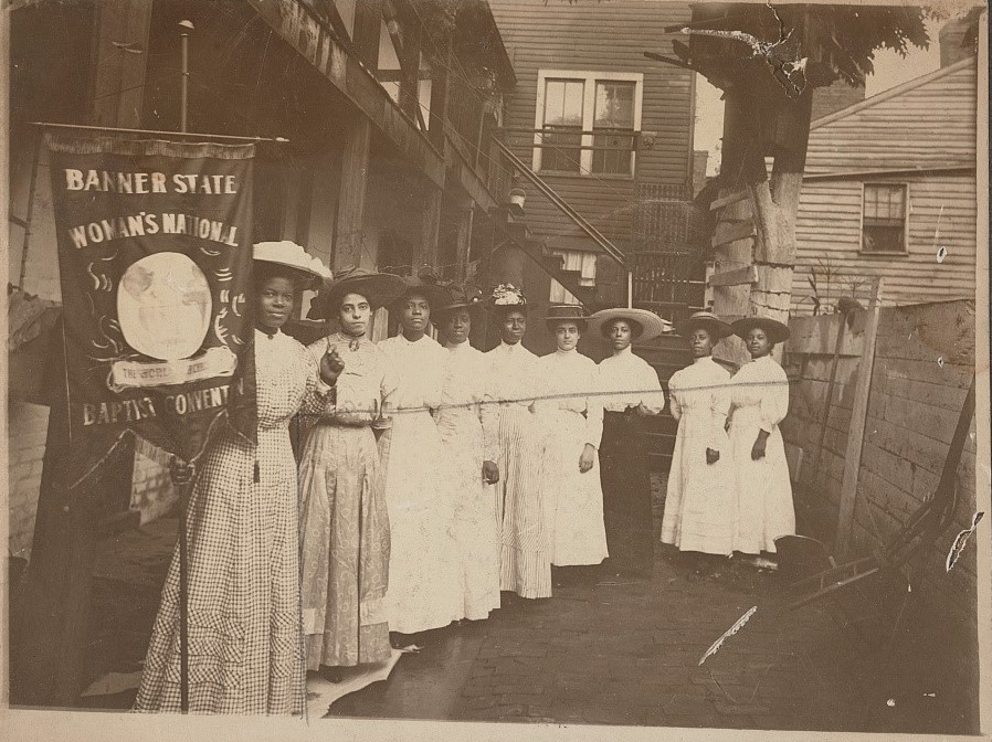 Dated between 1905 and 1915, this photo shows Nannie Helen Burroughs holding a banner that reads, “Banner State Woman’s National Baptist Convention.” Photo courtesy of Library of Congress