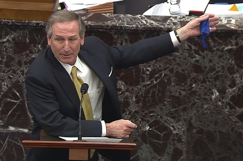 In this image from video, Michael van der Veen, an attorney for former President Donald Trump, answers a question from Sen. Bill Cassidy, R-La., during the second impeachment trial of former President Donald Trump in the Senate at the U.S. Capitol in Washington, Friday, Feb. 12, 2021. CREDIT: Senate Television via AP