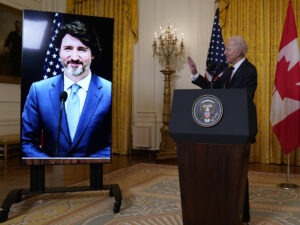 The White House tried to simulate some of the pomp of an official visit during a virtual meeting between President Biden and Canadian Prime Minister Justin Trudeau on Tuesday. CREDIT: Evan Vucci/AP