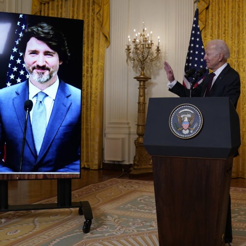 The White House tried to simulate some of the pomp of an official visit during a virtual meeting between President Biden and Canadian Prime Minister Justin Trudeau on Tuesday. CREDIT: Evan Vucci/AP