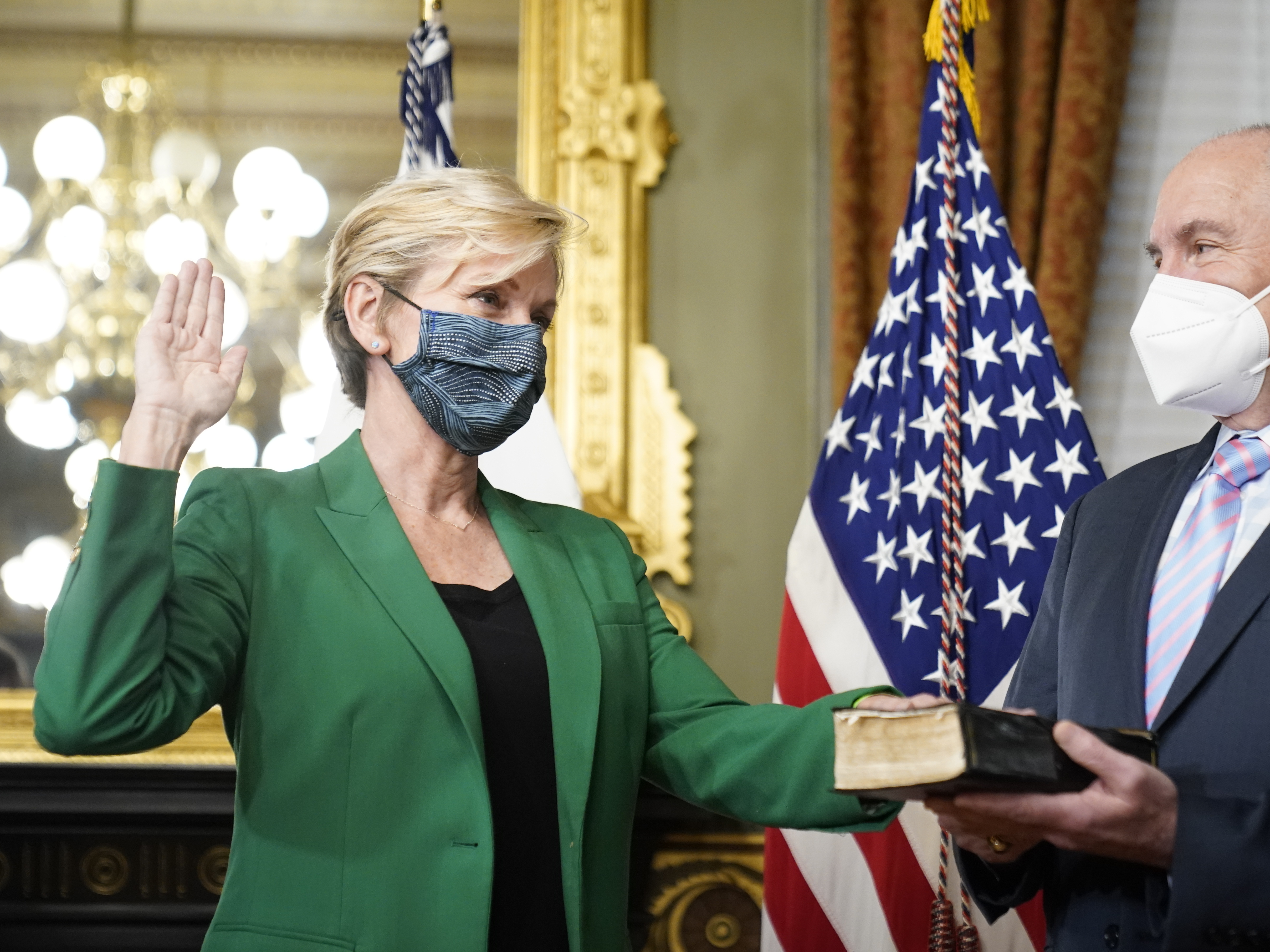 Jennifer Granholm is sworn in as energy secretary Thursday. Granholm told NPR that pivoting to a clean energy economy could ensure a dependable grid and help create jobs. Andrew Harnik/AP