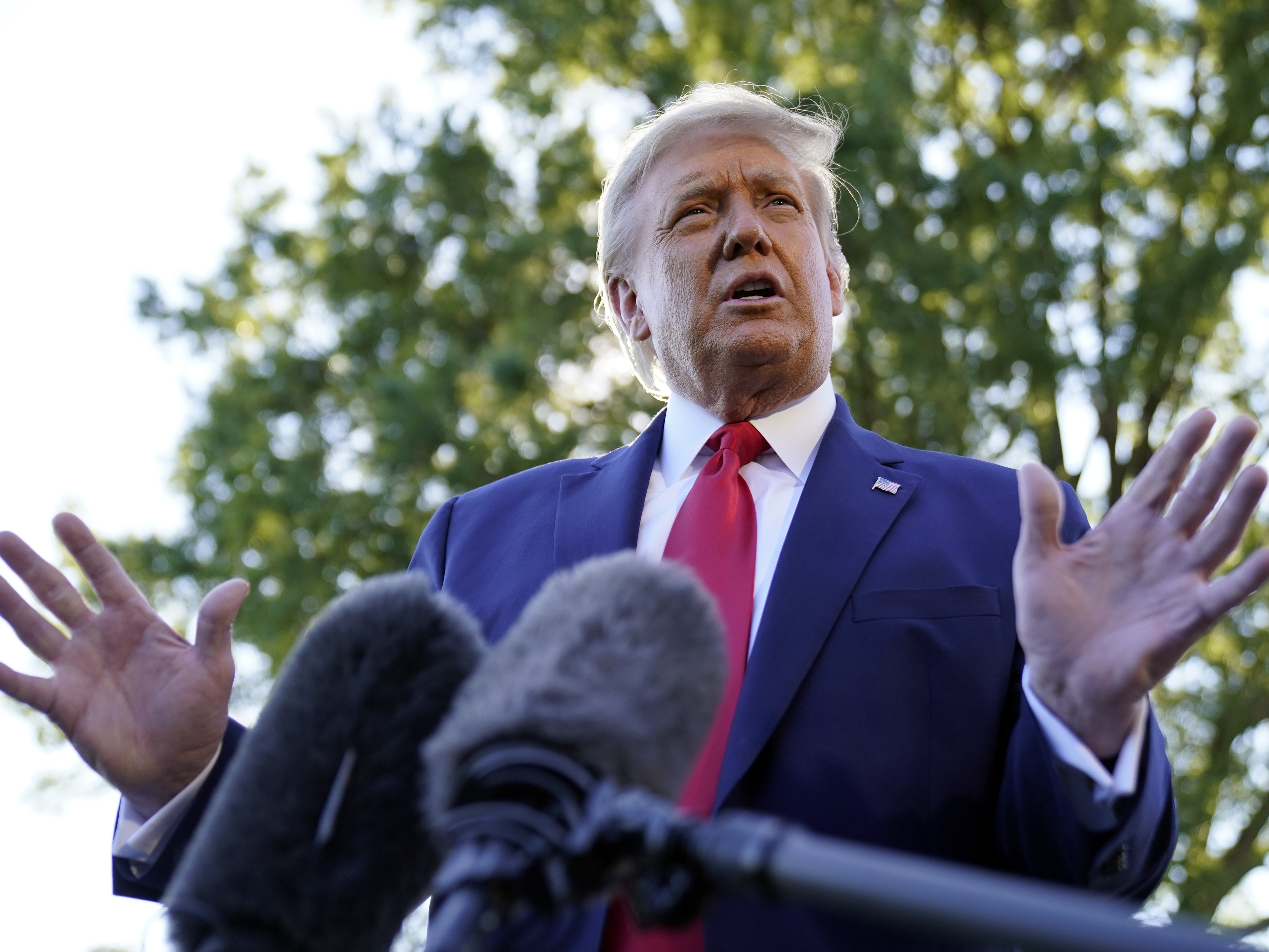 President Donald Trump speaks to reporters on the South Lawn of the White House, Monday, Sept. 21, 2020, before leaving for a short trip to Andrews Air Force Base, Md., and then onto Ohio for rallies. (AP Photo/Andrew Harnik)