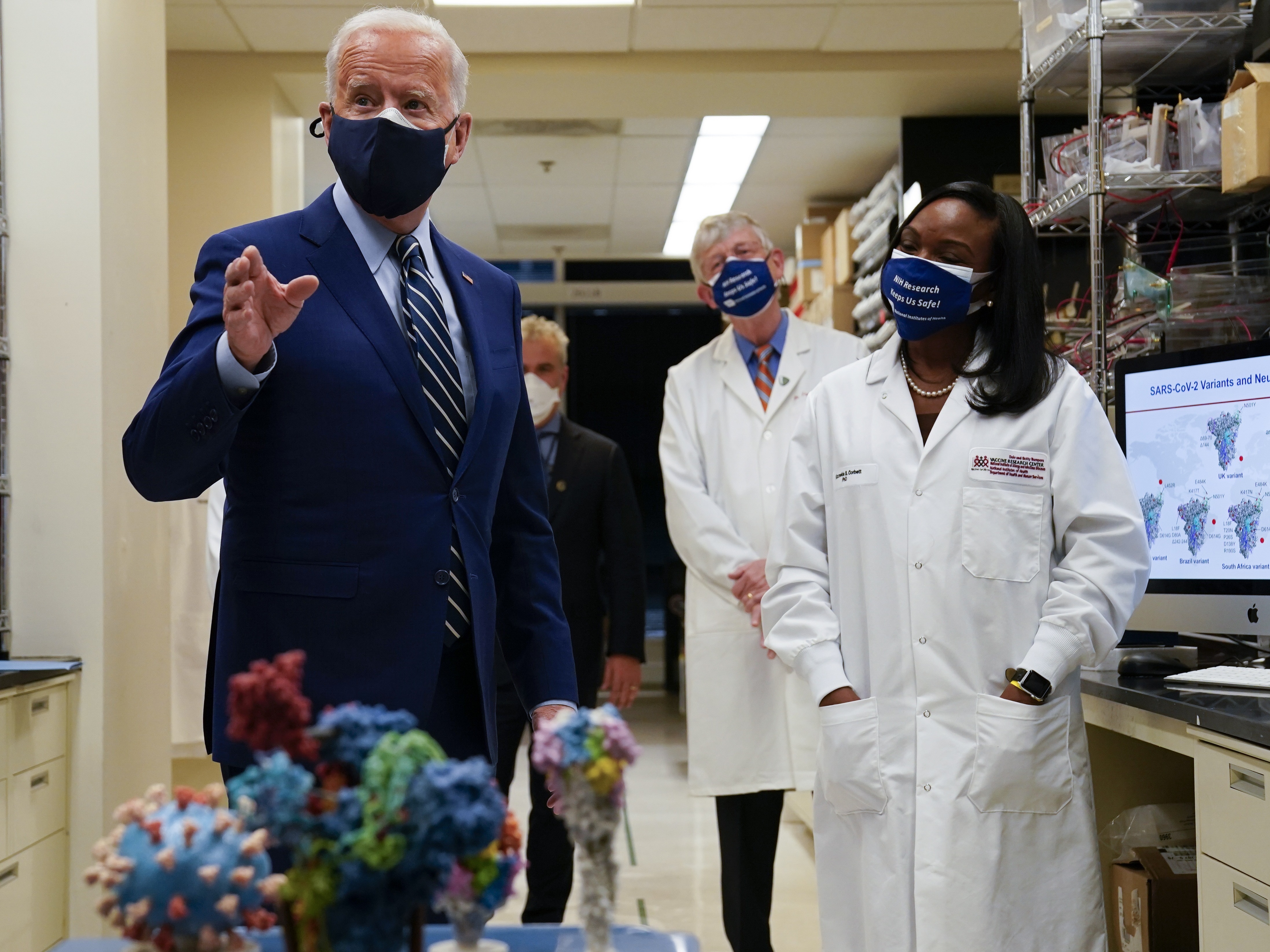 During remarks at the National Institutes of Health, President Joe Biden said his administration has secured enough Covid-19 vaccines to ensure the nation is on track to vaccinate 300 million Americans by mid-July. CREDIT: Evan Vucci/AP