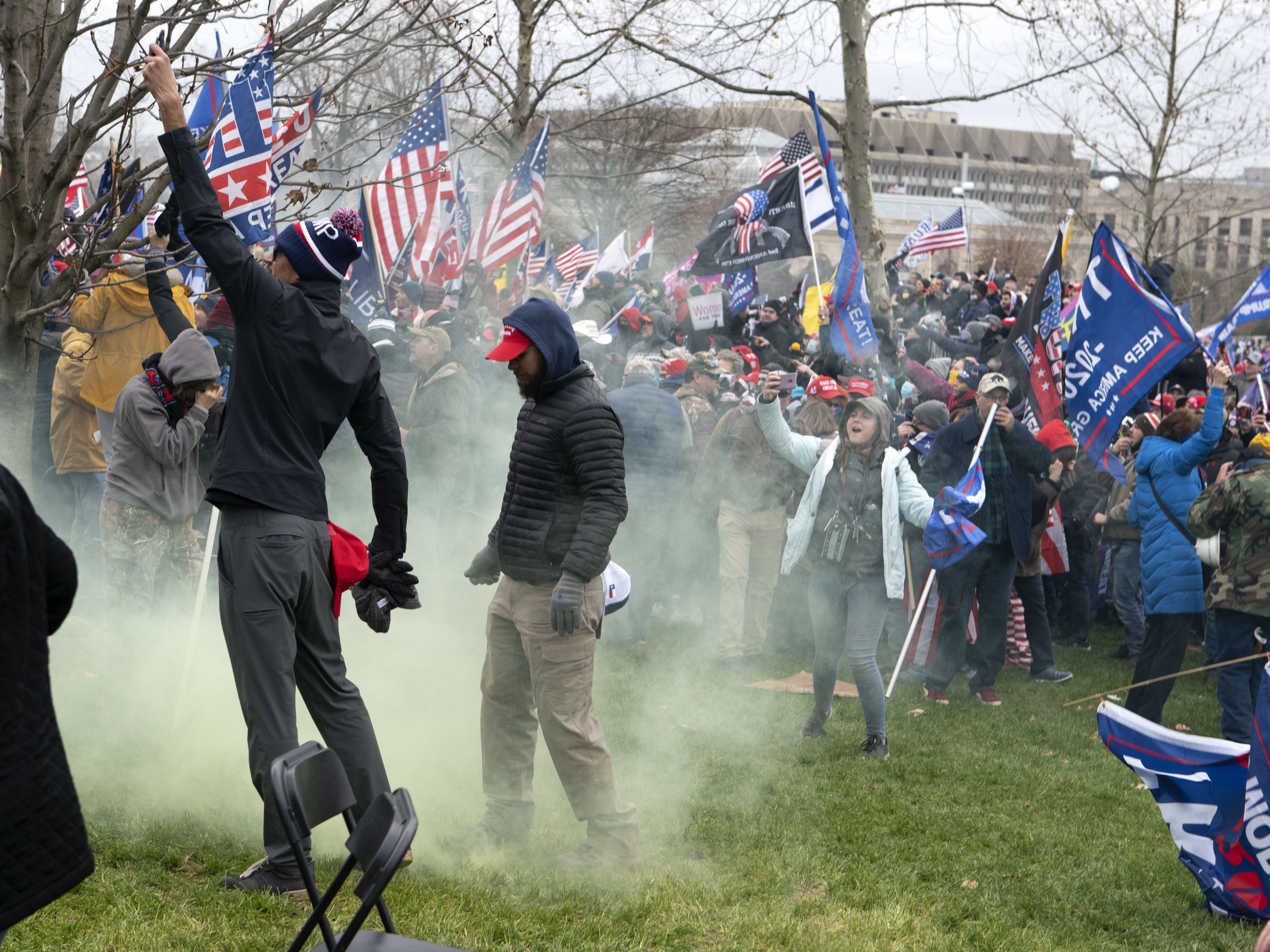 Supporters of former President Donald Trump protest as U.S. Capitol Police officers shoot tear gas outside of the U.S. Capitol on Jan. 6. CREDIT: Jose Luis Magana/AP