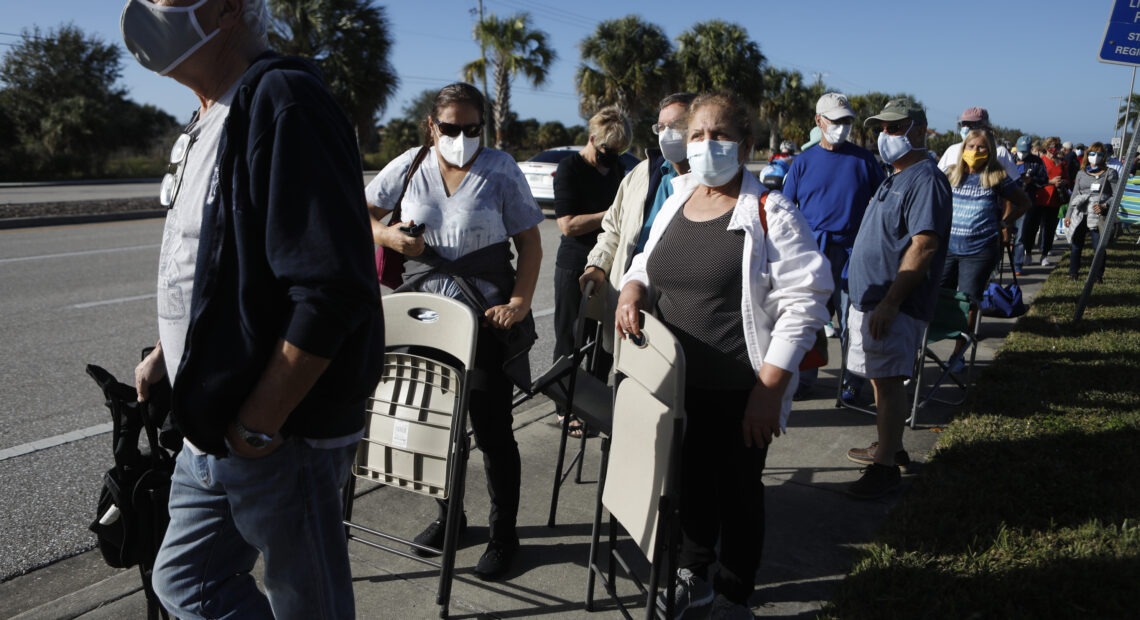 Seniors and first responders try to snag one of 800 doses available at a vaccination site in Fort Myers, Fla. Octavio Jones/Getty Images