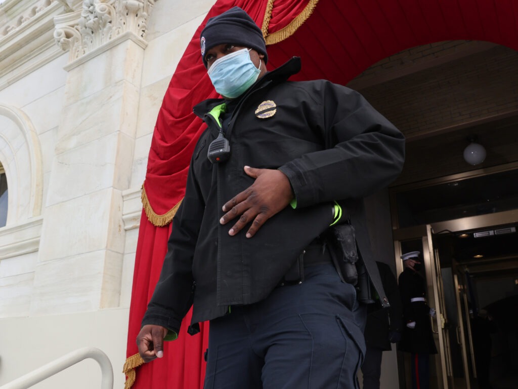 Capitol Police Officer Eugene Goodman, hailed by many for his heroism during the Jan. 6 attack on the U.S. Capitol, participates in a the dress rehearsal for Inauguration Day. CREDIT: Pool/Getty Images