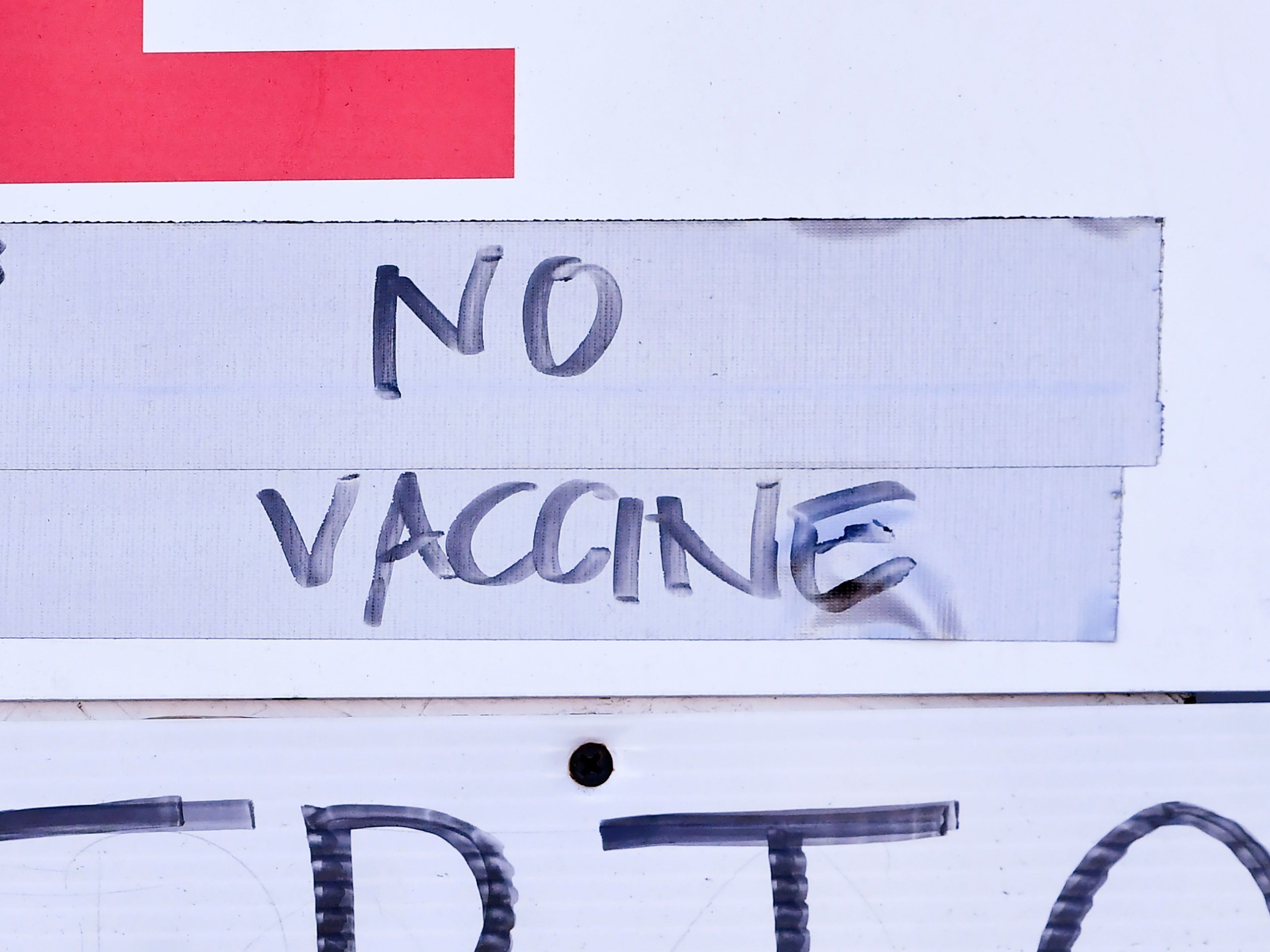 A sign at a vaccination site in Los Angeles reflects the holdup in vaccine distribution as a result of this week's storms. White House officials said Friday that the extreme weather delayed the shipment of some 6 million doses across the country. CREDIT: Frederic J. Brown/AFP via Getty Images