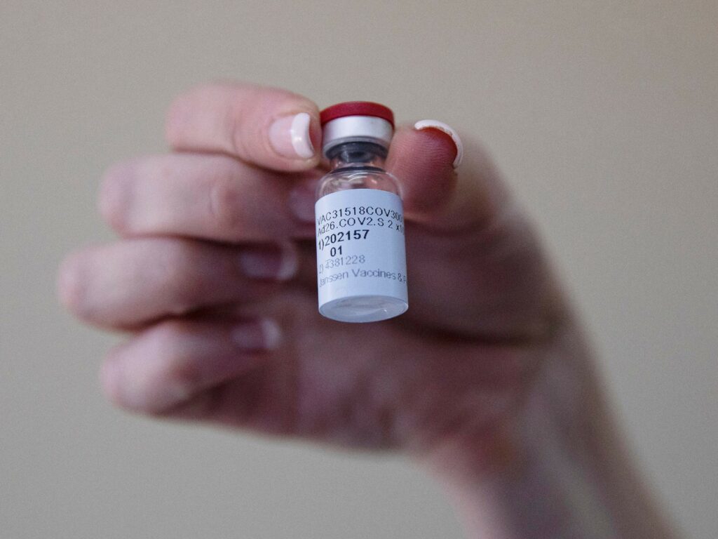 A health care worker holds a vial of the Johnson & Johnson COVID-19 vaccine at Klerksdorp Hospital in Klerksdorp, South Africa, on Feb. 18. CREDIT: Phill Magakoe via Getty Images