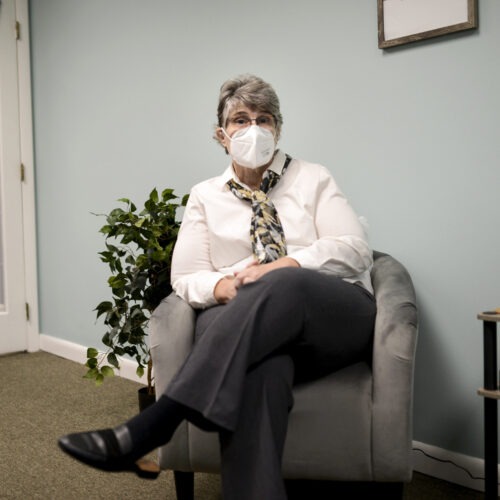 Jodee Pineau-Chaisson sits in her office in Springfield, Mass. on January 12, 2021. Pineau-Chaisson, a social worker, contracted the coronavirus last May and continues to have symptoms even months after testing negative for the virus. Meredith Nierman/GBH News