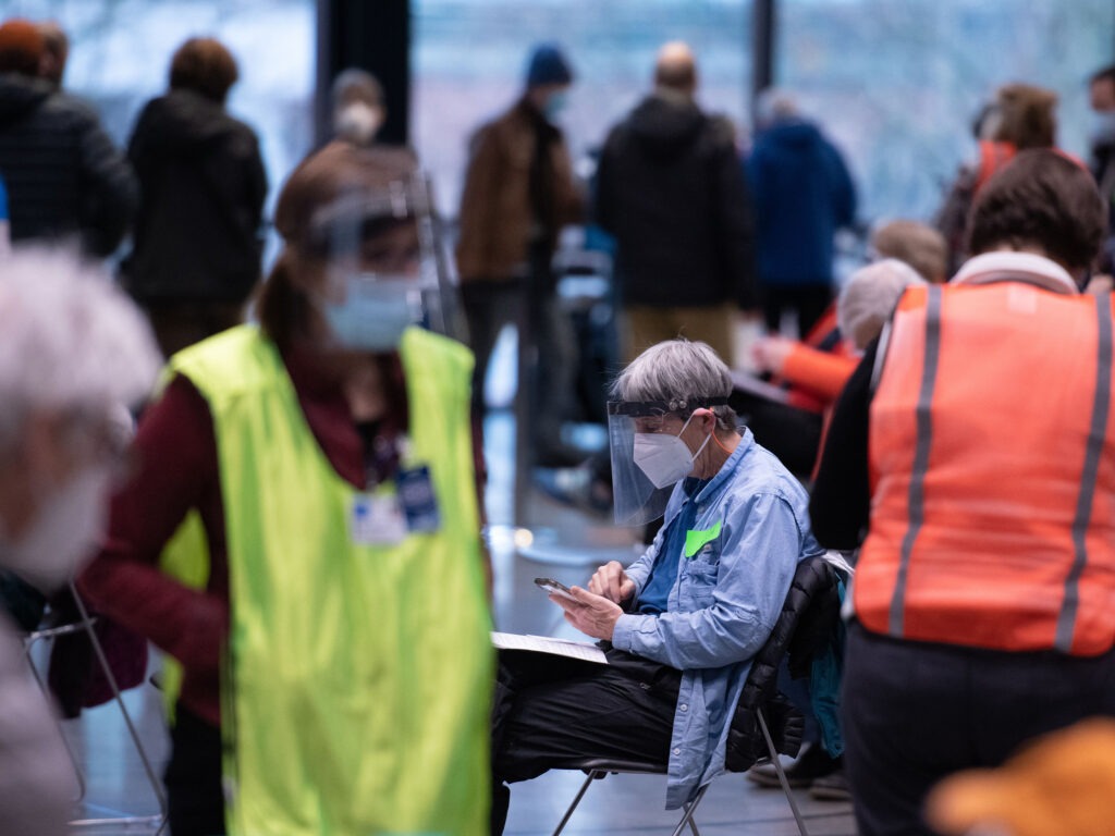 Workers and patients at a pop-up COVID-19 vaccination site near downtown Seattle in January. 