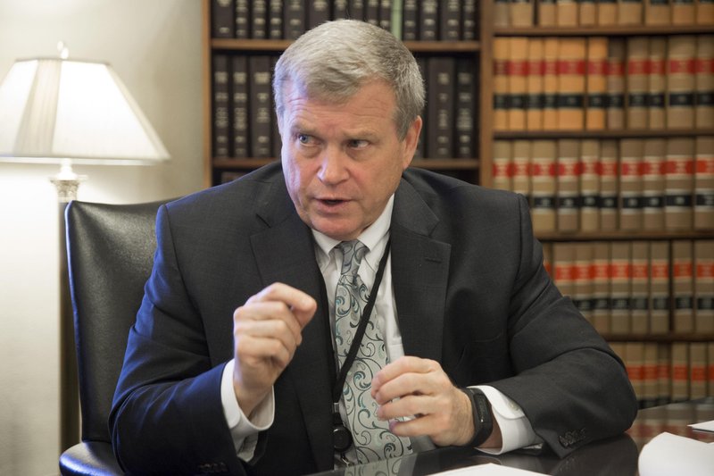 File photo. Idaho Attorney General Lawrence Wasden during a 2017 interview in Boise. GOP Idaho lawmakers frustrated with the Republican Idaho attorney general have put forward a series of bills that could significantly defund his office. Wasden irked lawmakers by not joining a Texas lawsuit to invalidate the presidential election. CREDIT: Darin Oswald/Idaho Statesman via AP