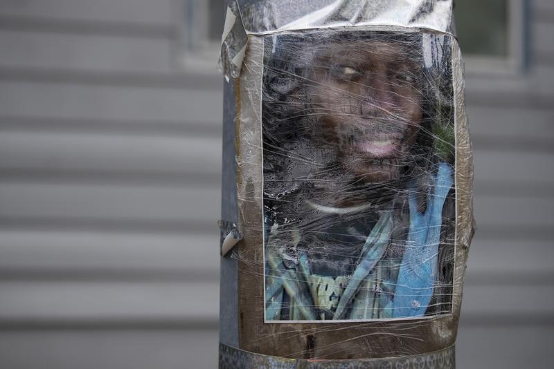 An image of Manuel "Manny" Ellis is taped to a utility pole on Thursday, June 4, 2020, near the intersection of Ainsworth Avenue South and 96th Street South in Tacoma. Ellis was killed by police on March 3rd, 2020