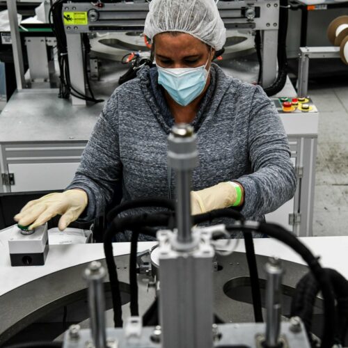 An employee makes respiratory masks in a family-owned medical equipment factory in Miami on Feb. 15. American manufacturers are thriving but they are running into an unexpected problem: finding critical supplies. CREDIT: Chandan Khanna/AFP via Getty Images