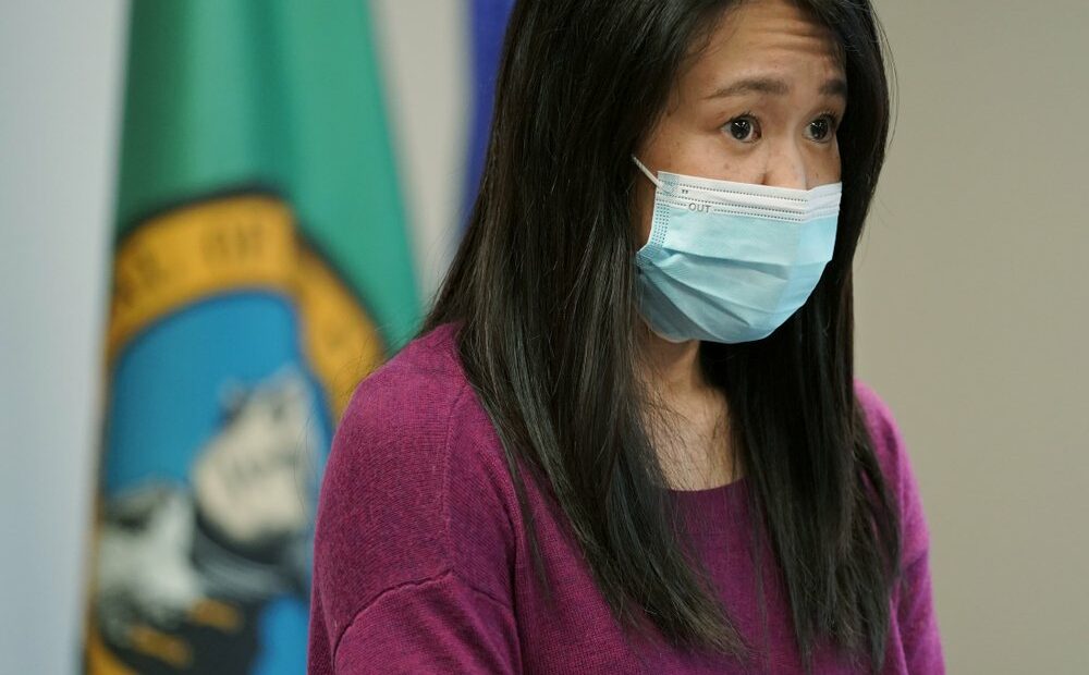 Noriko Nasu, a high school teacher who was attacked earlier in the year while walking through Seattle's Chinatown-International District, speaks about the possible hate crime Monday, March 22, 2021, at a news conference at Renton City Hall in Renton, Wash., south of Seattle. Nasu joined Washington Gov. Jay Inslee and other leaders Monday to denounce recent acts of violence and harassment targeted at Asians and Asian communities. CREDIT: Ted S. Warren/AP