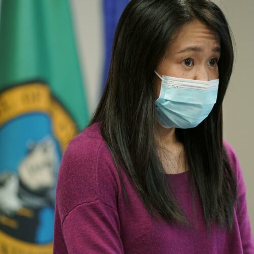 Noriko Nasu, a high school teacher who was attacked earlier in the year while walking through Seattle's Chinatown-International District, speaks about the possible hate crime Monday, March 22, 2021, at a news conference at Renton City Hall in Renton, Wash., south of Seattle. Nasu joined Washington Gov. Jay Inslee and other leaders Monday to denounce recent acts of violence and harassment targeted at Asians and Asian communities. CREDIT: Ted S. Warren/AP