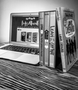 A picture of author Becky Albertalli's website and book collection.