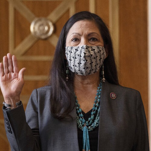 Rep. Deb Haaland, D-N.M., is sworn in before her Senate confirmation hearing to be Interior Secretary last month. Her confirmation makes her the country's first Native American cabinet secretary. CREDIT: Jim Watson/AP