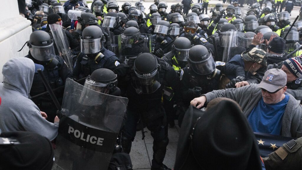 U.S. Capitol Police push back rioters trying to enter the U.S. Capitol in Washington on Jan. 6. CREDIT: Jose Luis Magana/AP