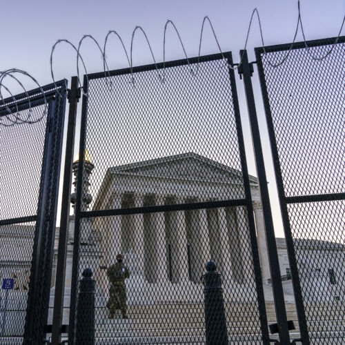 National Guard troops keep watch Thursday, March 4, 2021 at the Supreme Court. J. Scott Applewhite/AP