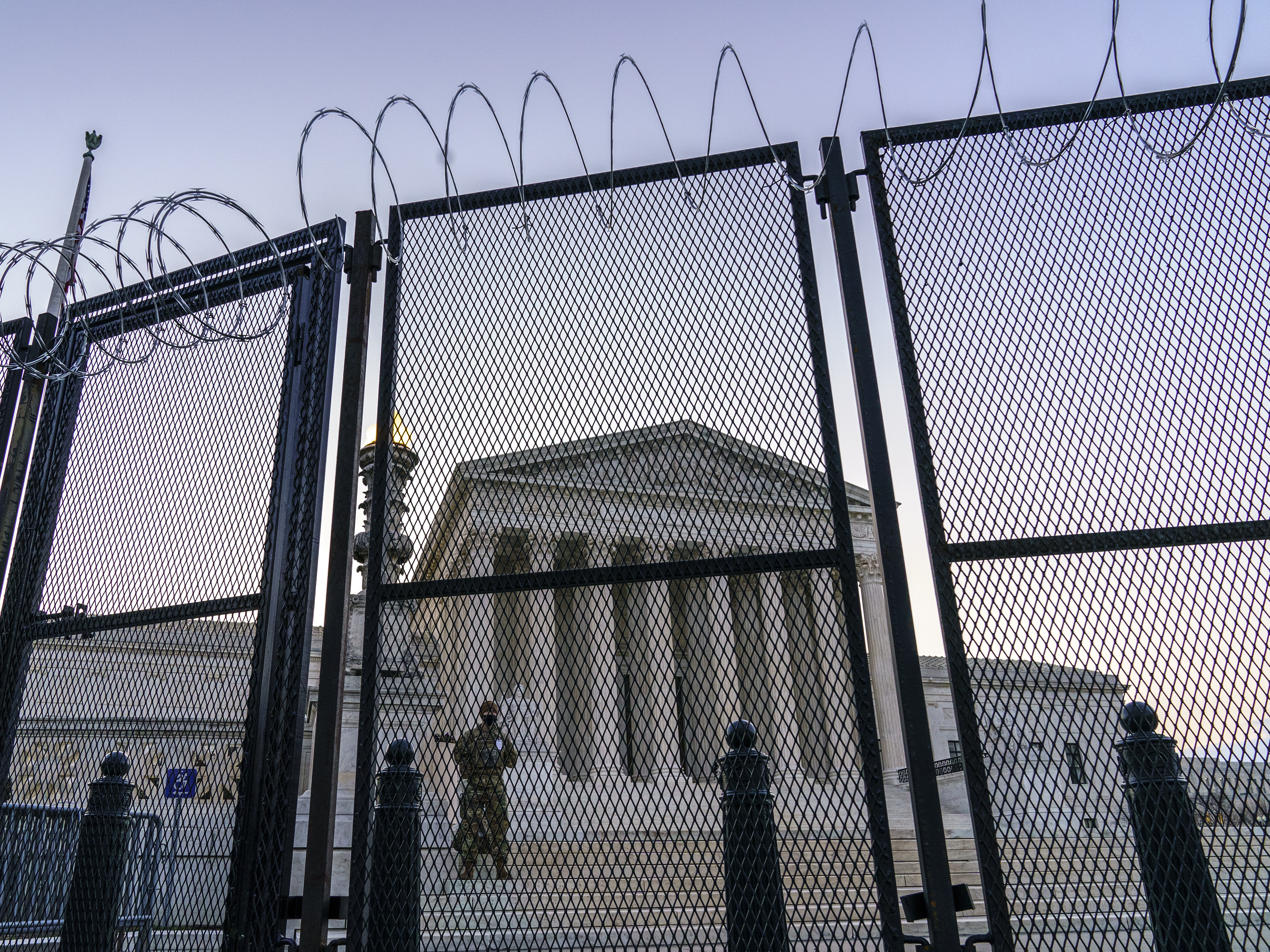 National Guard troops keep watch Thursday, March 4, 2021 at the Supreme Court. J. Scott Applewhite/AP