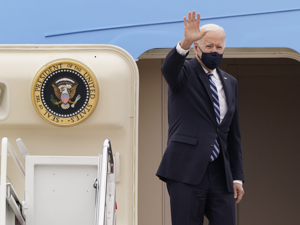 President Joe Biden waves before boarding Air Force One