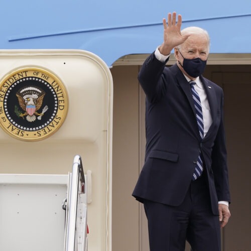 President Joe Biden waves before boarding Air Force One