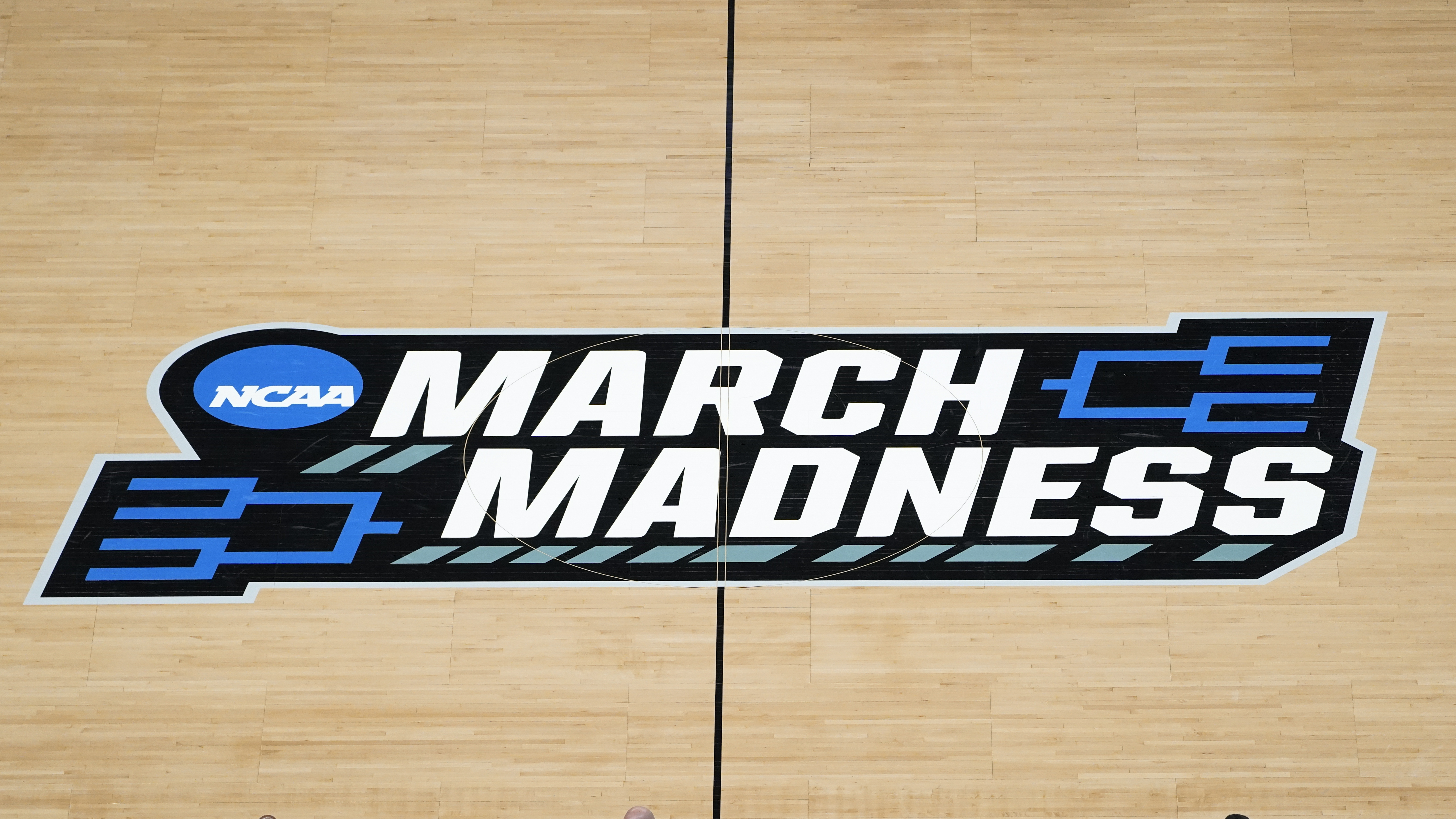 March Madness - NCAA logo - basketball court