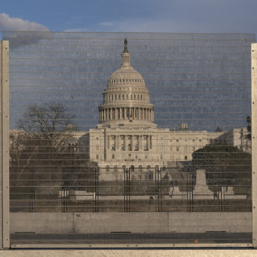 A section of fencing blocks the Capitol grounds at sunset on Monday. CREDIT: Jacquelyn Martin/AP
