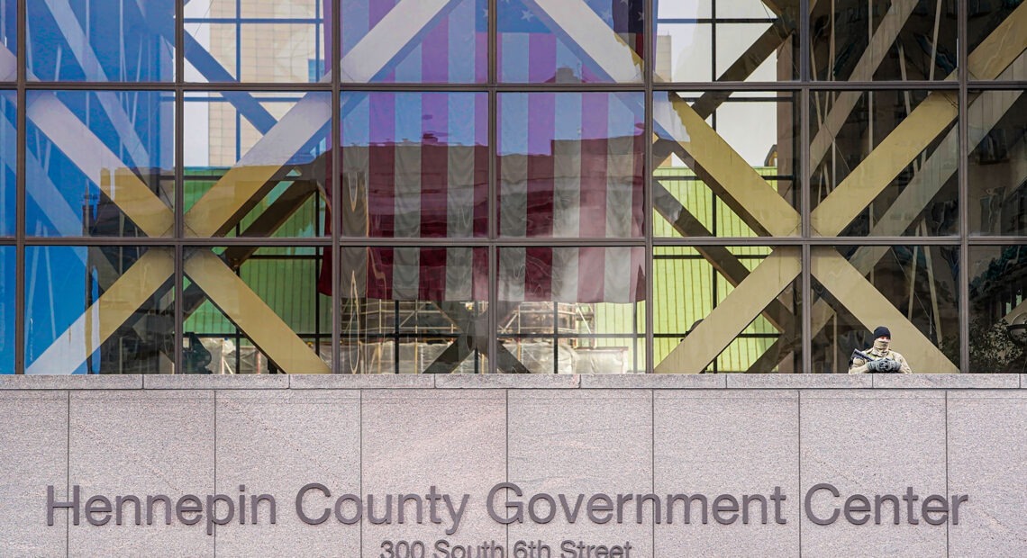 A member of the Minnesota National Guard stands outside the Hennepin County Government Center during jury selection in the trial of former Minneapolis police officer Derek Chauvin on March 11 in Minneapolis. Chauvin is facing murder charges in George Floyd's death. Among the 12 jurors and three alternates selected are three Black men, one Black woman and two multiracial jurors. CREDIT: Kerem Yucel/AFP via Getty Images