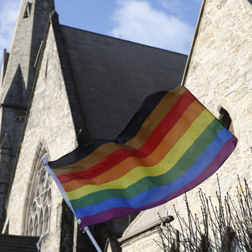 An LGBTQ+ flag flies over Union United Methodist Church in the South End of Boston on Jan. 5, 2020. On Epiphany Sunday, as local Methodists celebrated the visit of the Magi and marked the end of the Christmas season, they were also grappling with the possibility their church could split over a disagreement about LGBTQ participation in the faith. A group of United Methodist Church leaders made headlines Friday when they announced a proposal that would allow conservative congregations opposing same-sex marriage and the ordination of lesbian, gay, bisexual, transgender, and queer clergy to leave the UMC, form a new denomination, maintain their church assets, and get $25 million in the divorce. (Photo by Jessica Rinaldi/The Boston Globe via Getty Images)