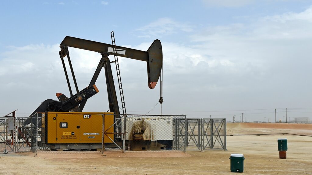 A pumpjack operates in the desert oil fields in southern Bahrain on April 22, 2020. Bahrain and other members of the OPEC+ alliance decided Thursday to keep output largely unchanged as they hope to push crude prices even higher after a recent rally. CREDIT: Mazen Mahdi/AFP via Getty Images