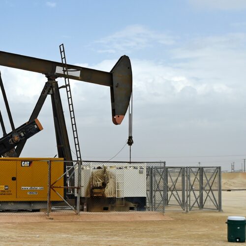 A pumpjack operates in the desert oil fields in southern Bahrain on April 22, 2020. Bahrain and other members of the OPEC+ alliance decided Thursday to keep output largely unchanged as they hope to push crude prices even higher after a recent rally. CREDIT: Mazen Mahdi/AFP via Getty Images