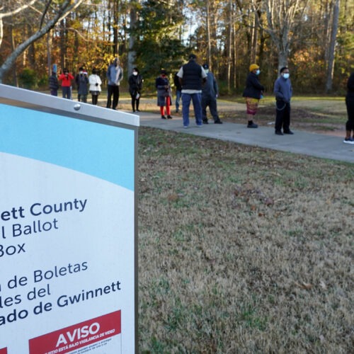 Voters stand in line to cast their ballots during the first day of early voting in the U.S. Senate runoffs at Lenora Park in Atlanta in December 2020. CREDIT: Tami Chappell/AFP via Getty Images