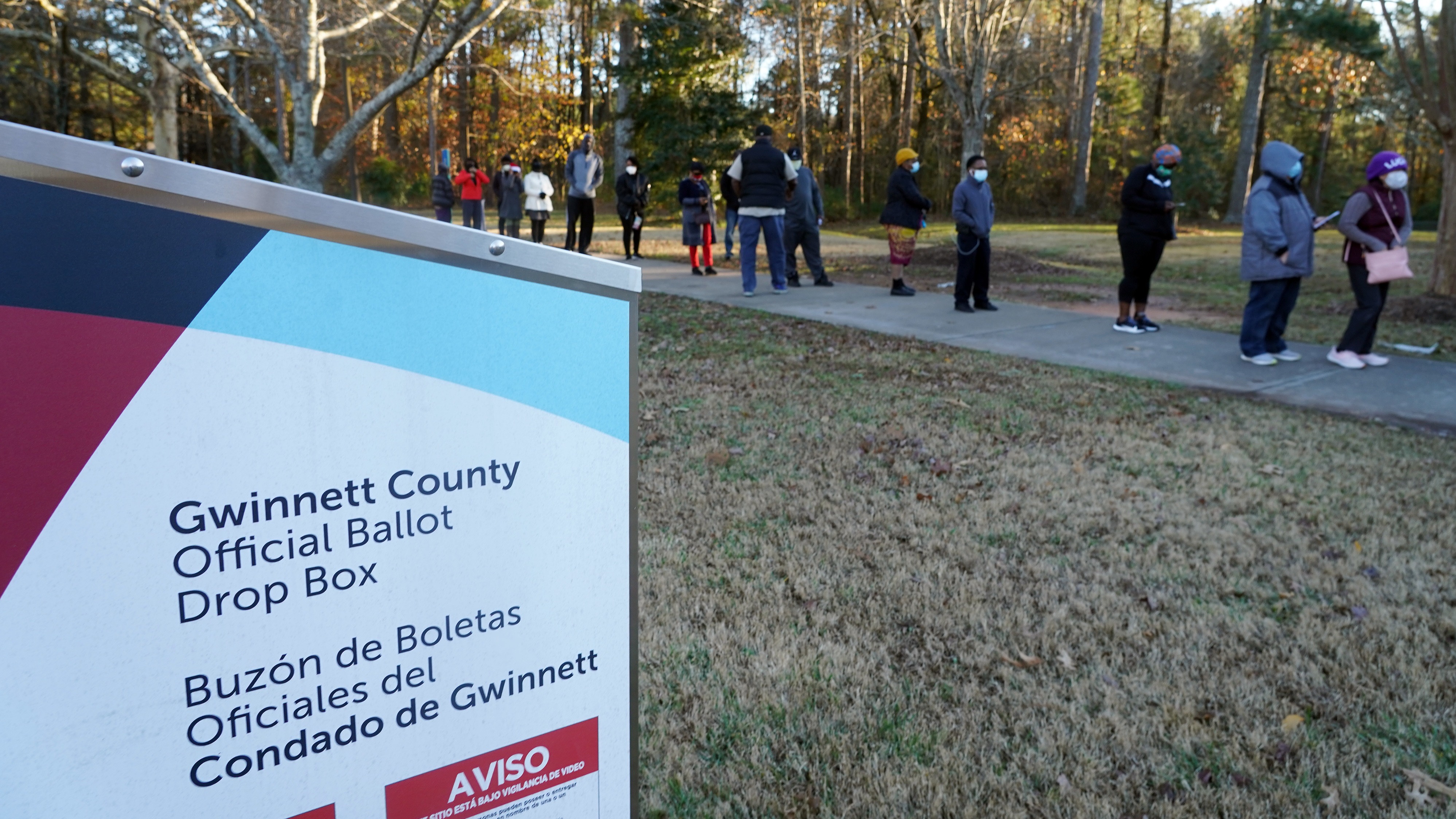 Voters stand in line to cast their ballots during the first day of early voting in the U.S. Senate runoffs at Lenora Park in Atlanta in December 2020. CREDIT: Tami Chappell/AFP via Getty Images