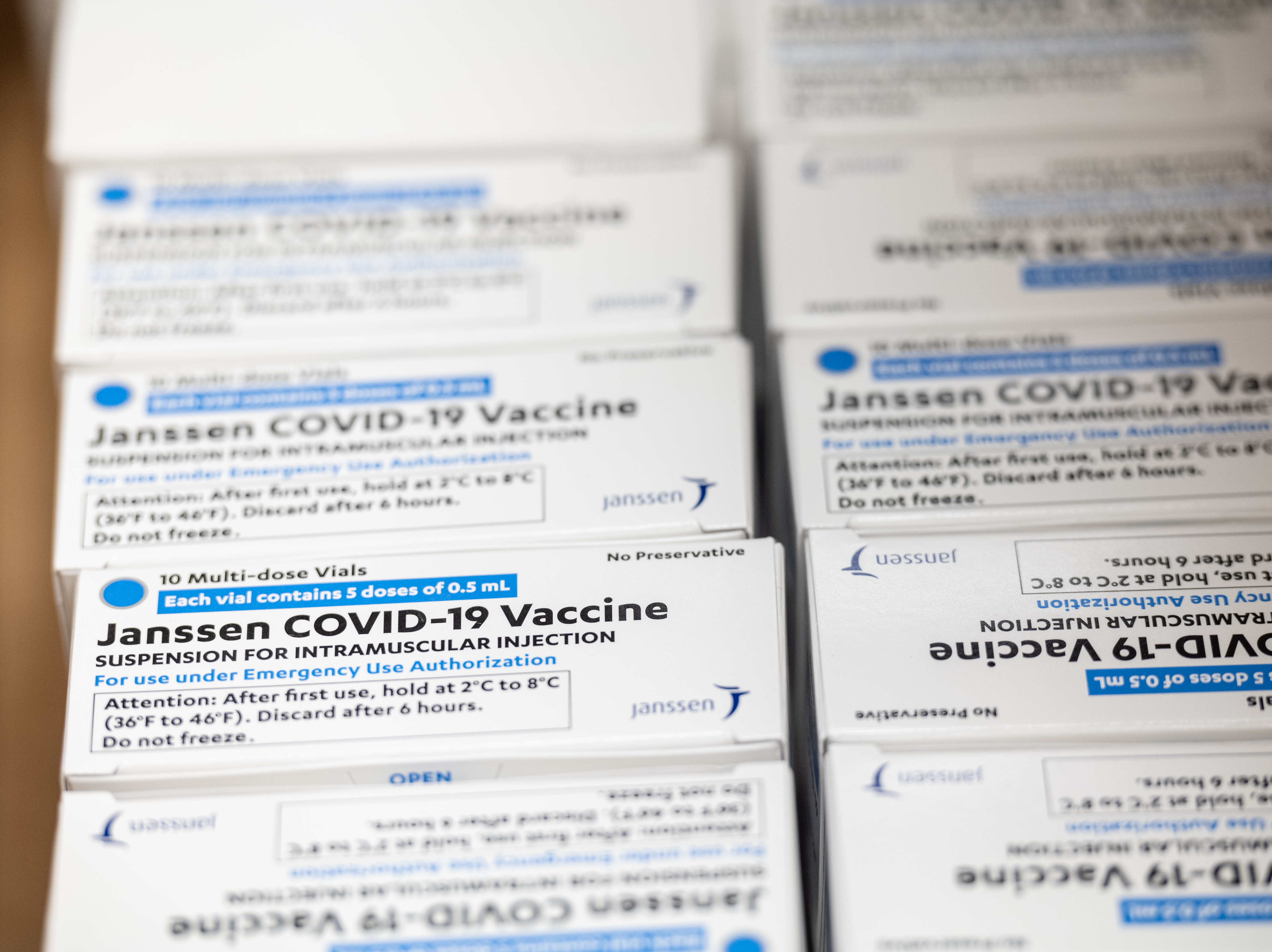 Boxes containing vials of the Janssen COVID-19 vaccine sit in a container before being transported to a refrigeration unit at Louisville Metro Health and Wellness headquarters on March 4 in Louisville, Ky. The FDA approved the third COVID-19 vaccine on Feb. 27. CREDIT: Jon Cherry/Getty Images