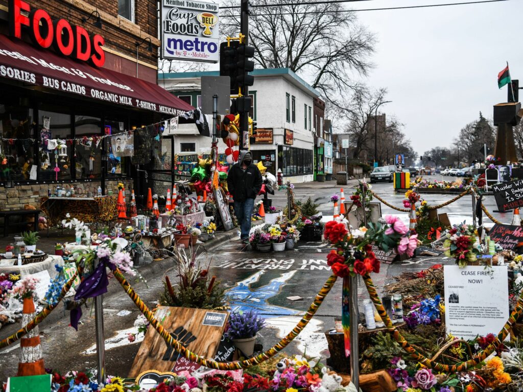 A makeshift memorial in Minneapolis honors George Floyd as jury selection begins in the trial of former police officer Derek Chauvin. CREDIT: Chandan Khanna/AFP via Getty Images