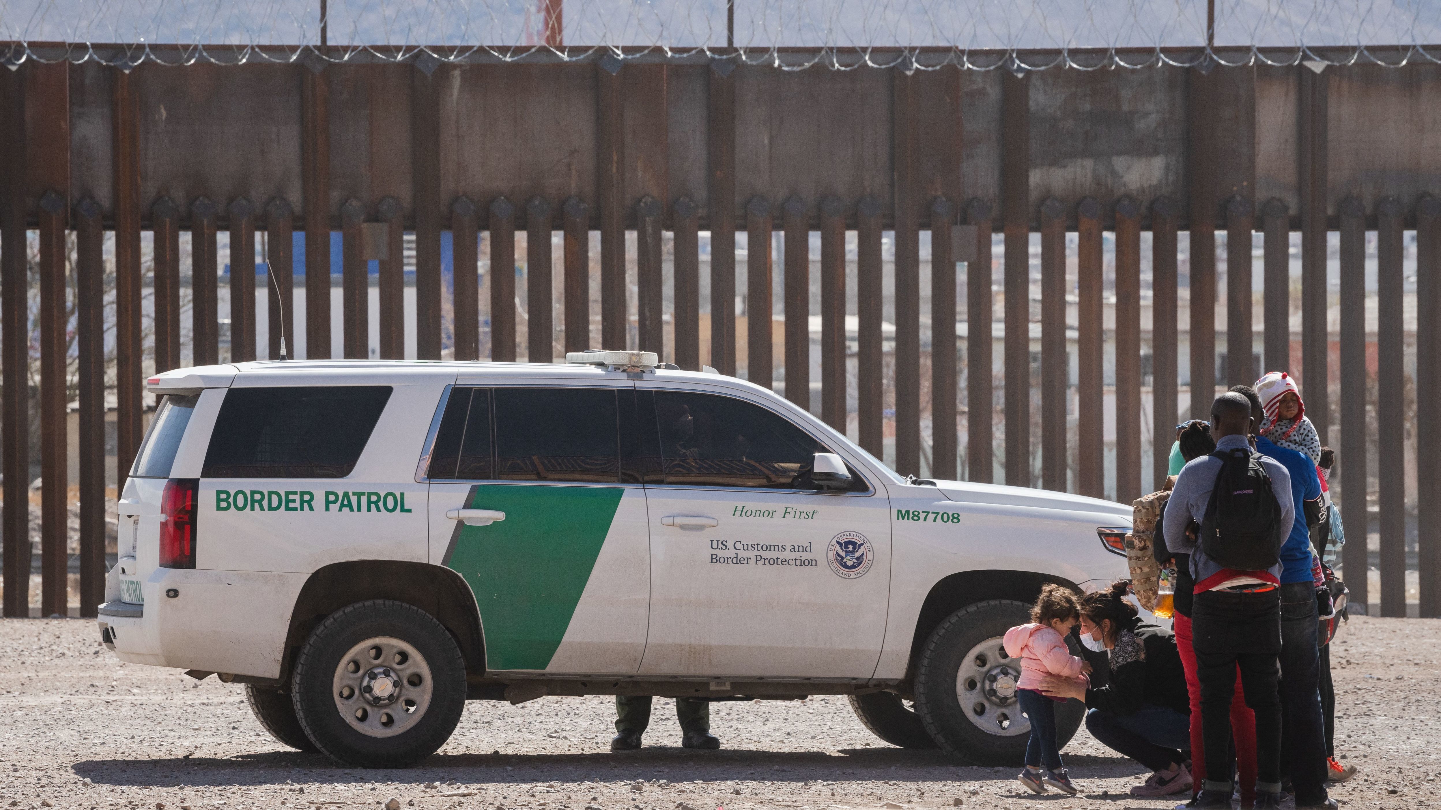 Border Patrol agents apprehend a group of migrants near downtown El Paso, Texas, on Monday. The Department of Homeland Security is struggling to manage a growing number of unaccompanied minors at the border. CREDIT: Justin Hamel/AFP via Getty Images