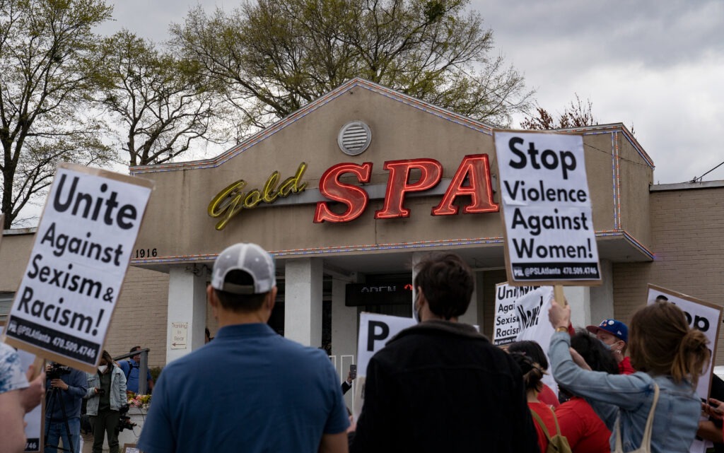 Activists demonstrate outside Gold Spa in Atlanta where a mass shooter killed three women on Tuesday night in a rampage that left eight people dead, including six Asian women. CREDIT: Megan Varner/Getty Images