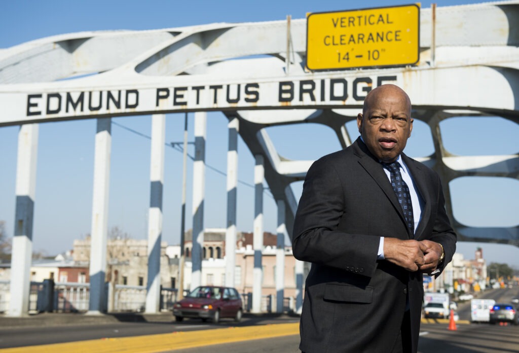 In 2015, the late Rep. John Lewis stands on the Edmund Pettus Bridge in Selma, Ala., where he was beaten by police on "Bloody Sunday." CREDIT: Bill Clark/CQ-Roll Call via Getty Images