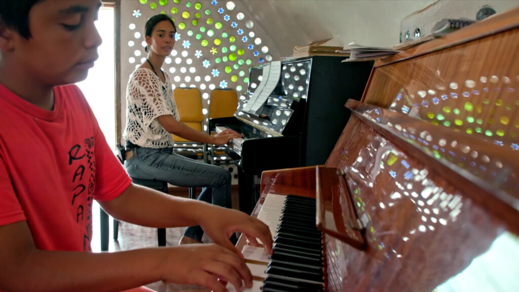 Mahani Teave teaches a student at her Toki School of Music on Easter Island. Fidget and Rushmore Films/Courtesy of the artist