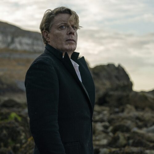 Eddie Izzard co-wrote the script for Six Minutes to Midnight, and stars as half German, half British teacher Thomas Miller. Courtesy of IFC Films