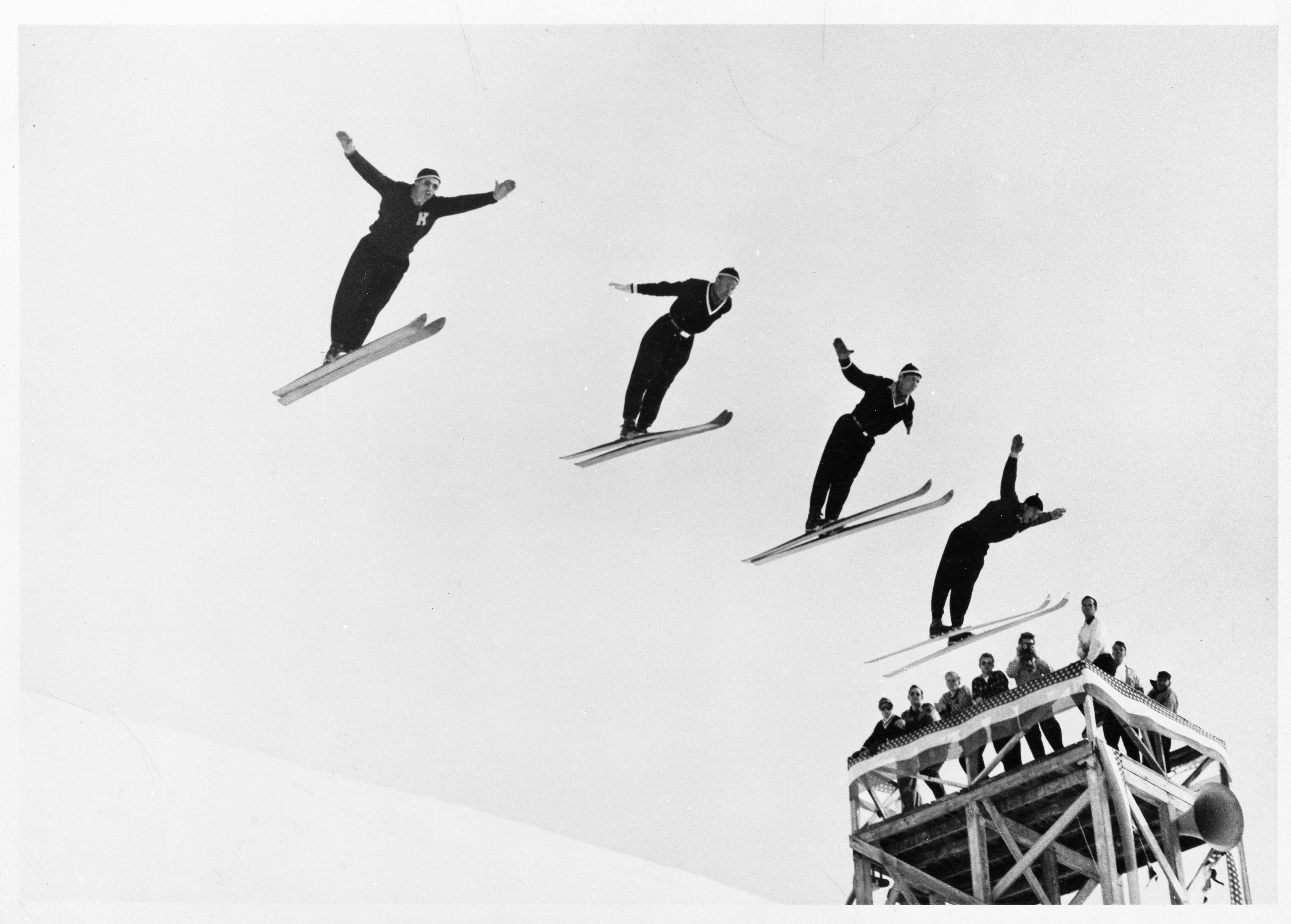 Olav Ulland, Gustav Raaum, Alf Engen, and Kjell Stordalen perform a four-person simultaneous ski jump at Sun Valley, Idaho, in December 1948. Courtesy of National Nordic Museum