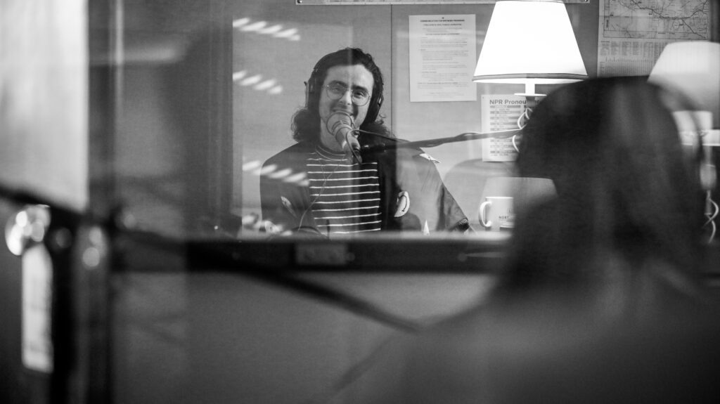 Cartoonist Jesse Clyde in-studio talking with host Sueann Ramella.
