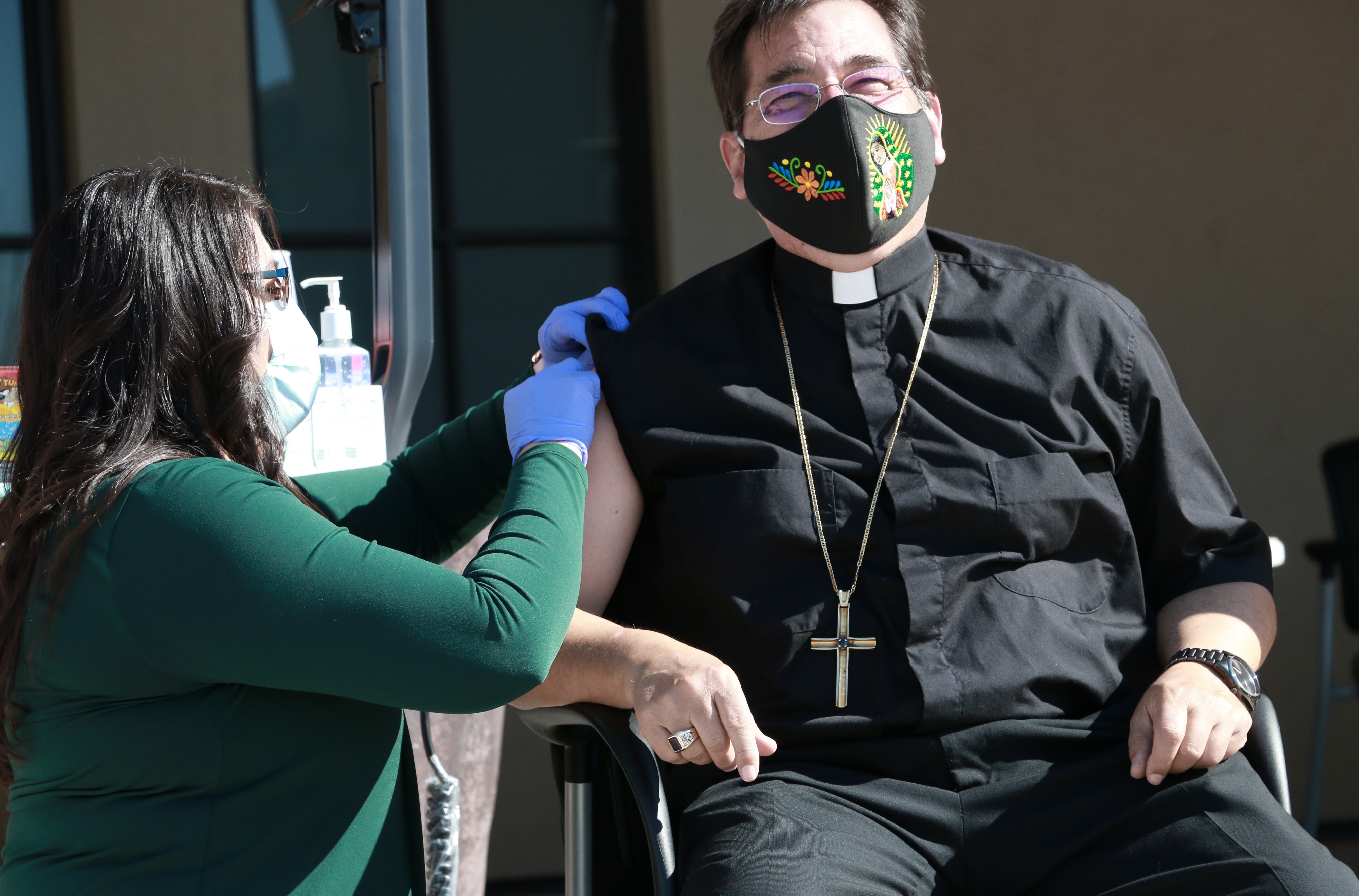 Bishop Joseph Tyson of the Diocese of Yakima rolled up his robes for the COVID-19 vaccine to encourage his parishioners to do the same.