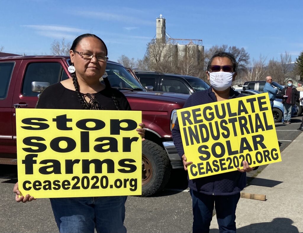 Elaine Harvey, left, a member of the Rock Creek band, Ka-milt-pah, of the Yakama Nation, at an April 1, 2021 demonstration in Goldendale opposing a solar farm project. CREDIT: Courtney Flatt/NWPB