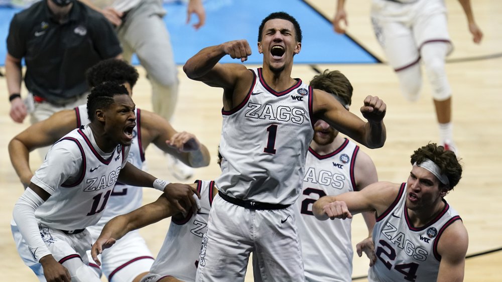 Gonzaga guard Jalen Suggs (1) celebrates making the game winning basket against UCLA during overtime in a men's Final Four NCAA college basketball tournament semifinal game, April 3, 2021, at Lucas Oil Stadium in Indianapolis. Gonzaga won 93-90 in overtime. CREDIT: Michael Conroy/AP